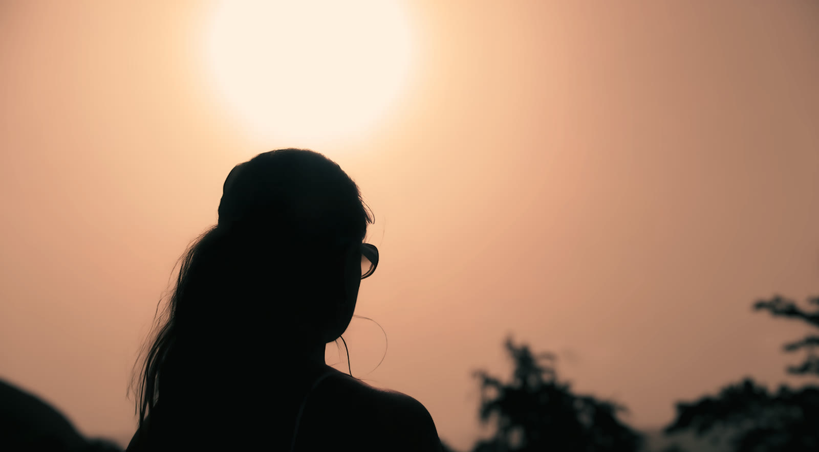 A woman at sunset